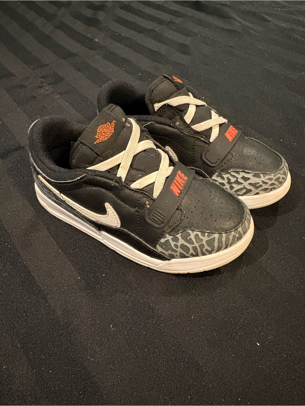 Nike Kids Black & White Sneakers with Elephant Print and Orange Accents